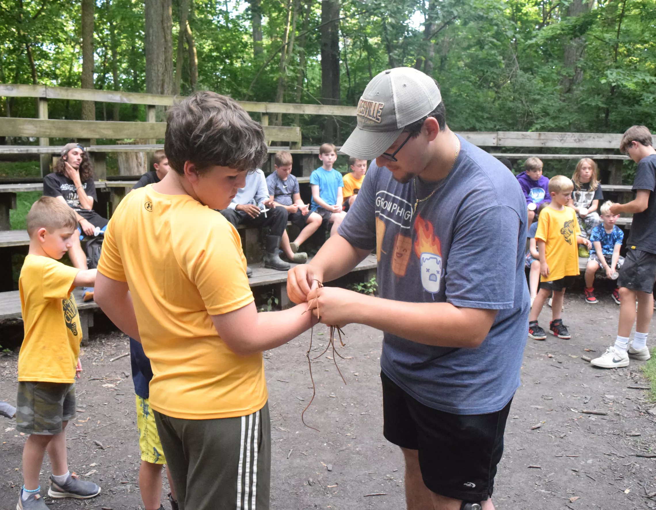staff helping a camper